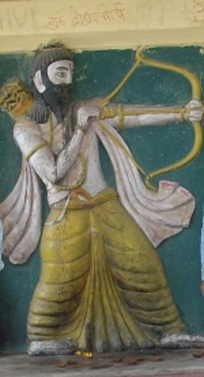 At the top of the mural, you'll find 'Guru Dronacharya' written in light letters