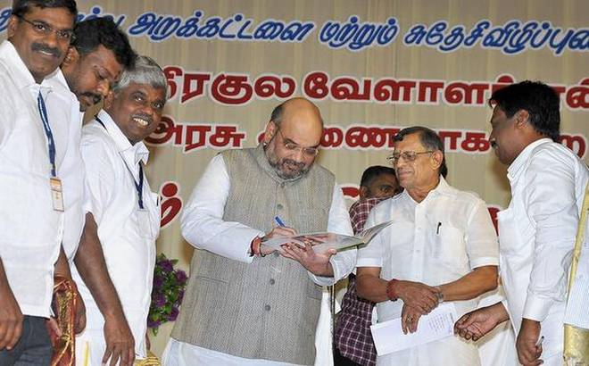 BJP president Amit Shah with S. Gurumurthy, co-convenor, Swadeshi Jagran Manch, at the Devendrakula Velalar conference in Madurai