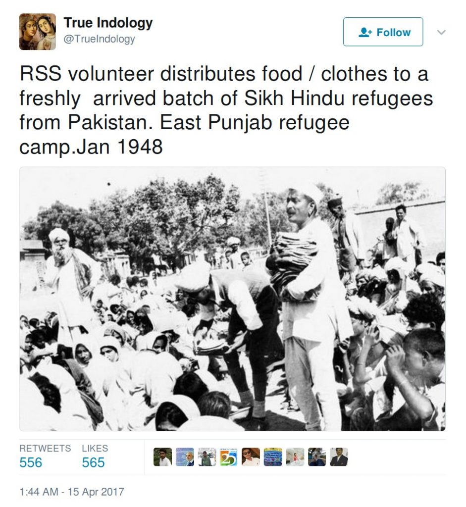 TrueIndology: RSS volunteer distributes food/clothes to a freshly arrived batch of Sikh HIndu refugees from Pakistan. East Punjab refugee camp. jan 1948