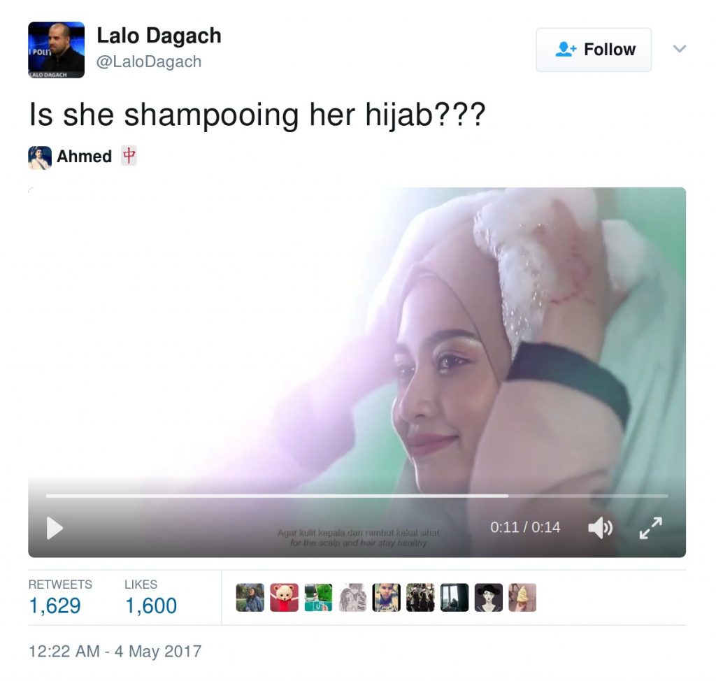 Is she shampooing her hijab?