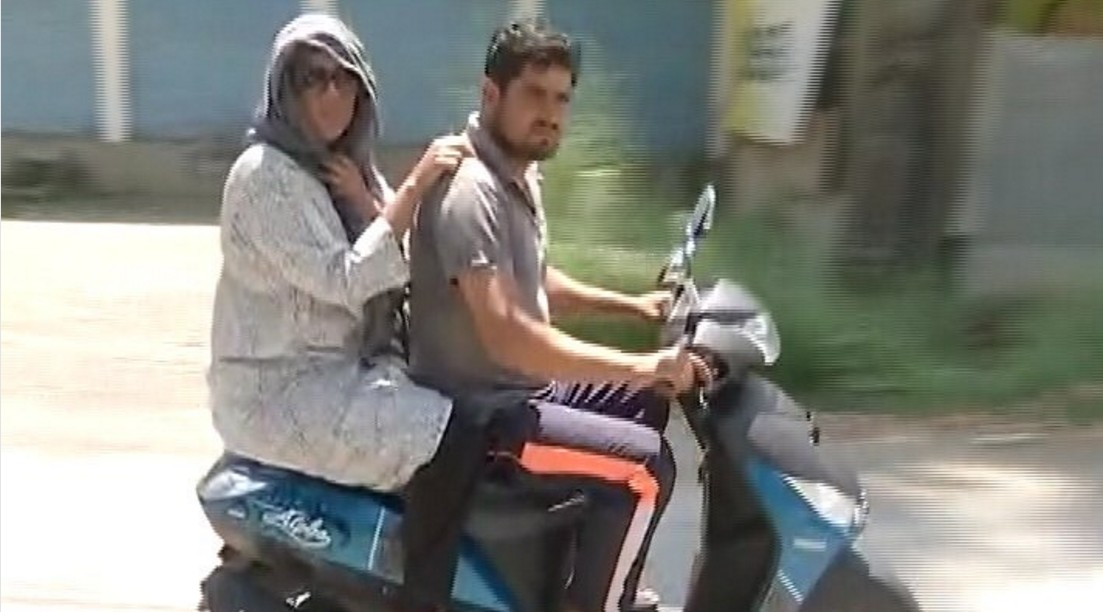 Barkha Dutta on a scooter in Budgam