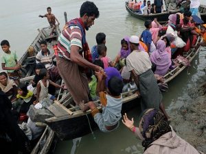 Rohingya refugees who arrived in Shah Porir Dwip from Myanmar last night, get into a boat to go to the mainland, in Teknaf, Bangladesh October 7, 2017. REUTERS/Mohammad Ponir Hossain
