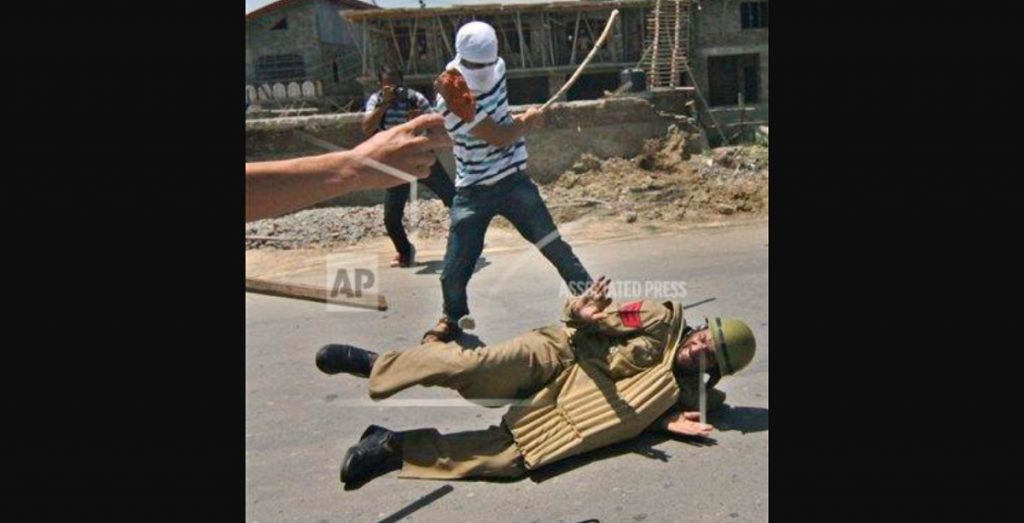 Old photo of assault on J & K cop by Kashmiri protesters viral on social media