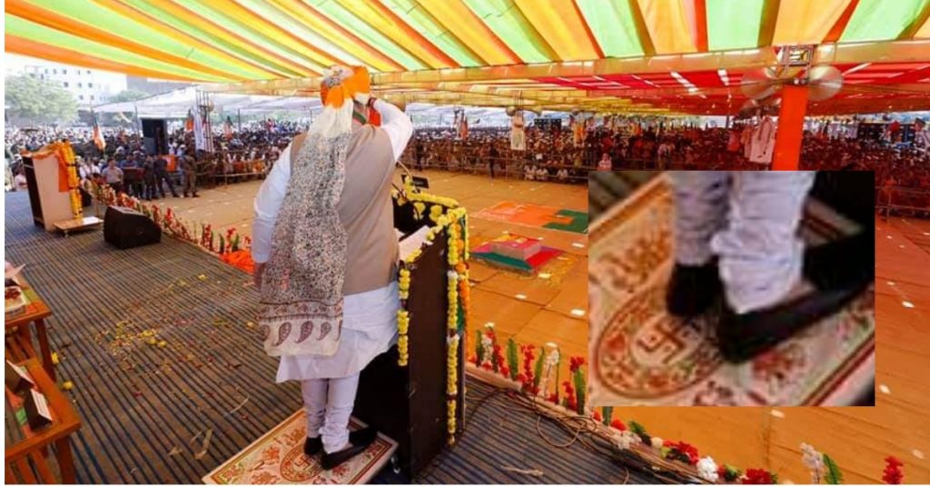 Is the photo of Amit Shah standing on Swastika real?
